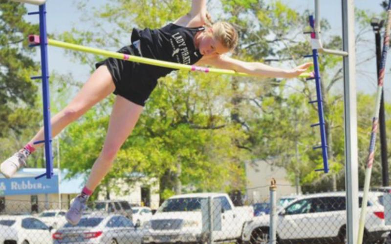 Lady Pirate Jaidyn Green clears 8”2’ to take first place in the girls’ pole vault event at the LCM Invitational Friday.
