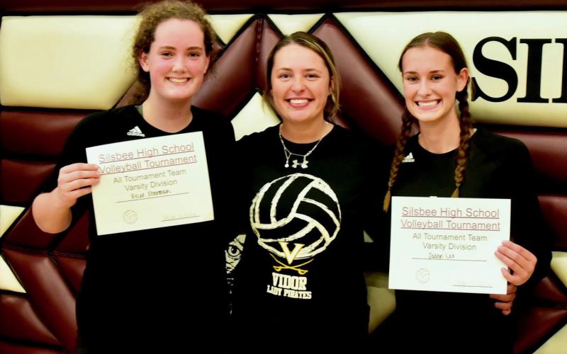 Rylee Sherman, left, and Jaden Lee, right were named to the All Tournament Team at the Silsbee Volleyball Tournament Saturday. They are pictured with Vidor’s first year Head Volleyball Coach Brooklyn Sampere. Photo by Randall Luker