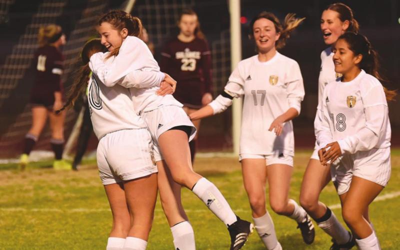 Teammates congratulate Chloe Post after she scored her fourth goal of the night against Silsbee, Pictured left to right are Taylor LaPray, Post, Amelia Wright, Jaden Lee and Johana Aguirre. Photo by Randall Luker
