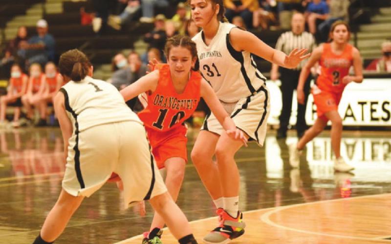Eighth A Lady Pirates Lakyn Croak, #1, and #31, Kinsey Dillard defend agains a charging Lady Bobcat.