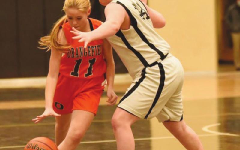 Eighth grade A team Lady Pirate Ayra Bratton blocks a Lady Bobcat Thursday in Pirate Gym.