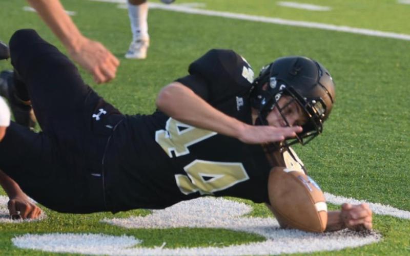 Tate Ardis recovers a Buna fumble Friday. Photo by Randall Luker