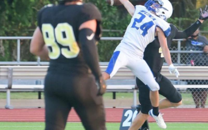 A Buna defender breaks up a deep pass to Vidor's Ricky Gall. Photo by Randall Luker