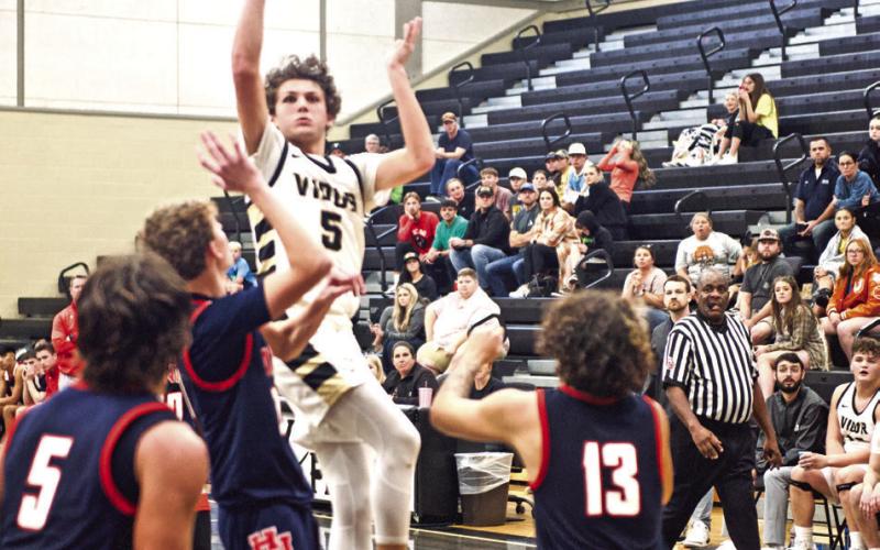 Bryce Loftin jumps to shoot a 3-pointer in Monday’s home game against Hardin-Jefferson.