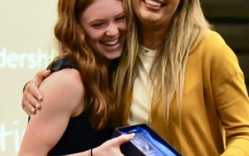Mallory Martin receives the Lady Pirate Leadership Award for soccer from Coach Sampere. Photos by Randall Luker