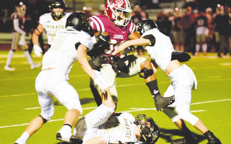 Pirate defenders team up to down a Jasper ball carrier.