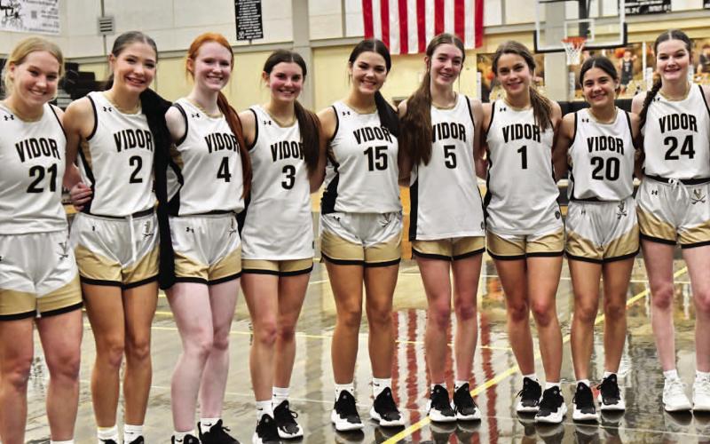 The Lady Pirates pose for a team photo after their 78-42 win over district foe Jasper.