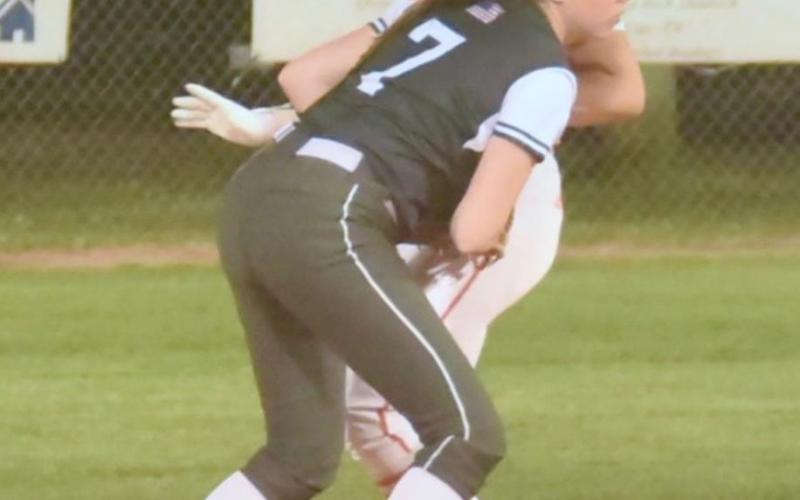 Brilie Cornelison tags out a Lady Bobcat runner at second base. Photo by Randall Luker
