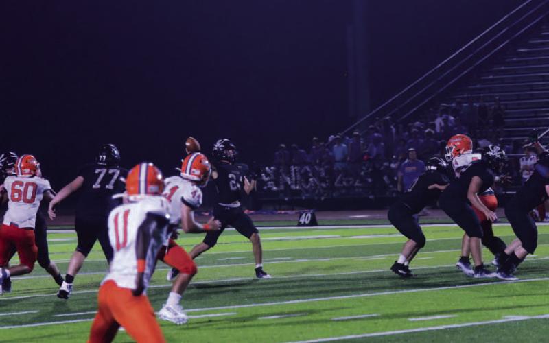The Throw - Jarrett Odom lets fly a 30-yard TD pass to Daigen Venable who got behind the Saints’ defense and caught the ball in stride for a touchdown to put the Pirates up 45-14 with 2:19 left in the third quarter. Photos by Randall Luker