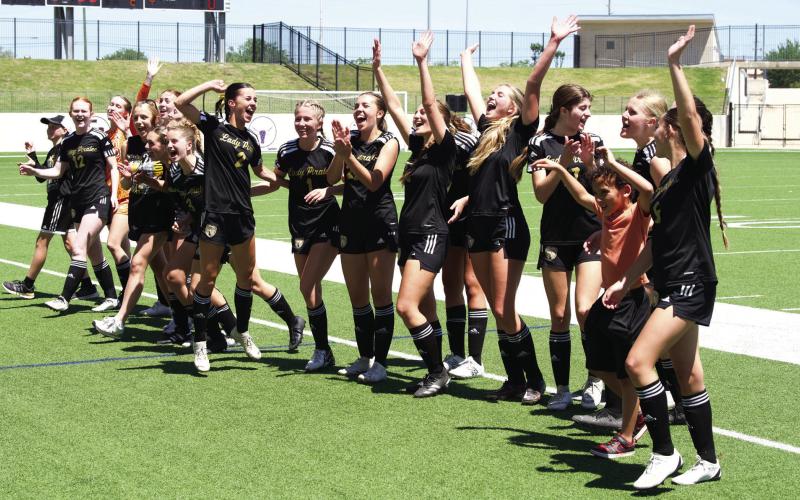 The Lady Pirates join with fans to sing VHS’ school song, Hail Alma Mater following the team’s victory over the Giddings Lady Buffs.