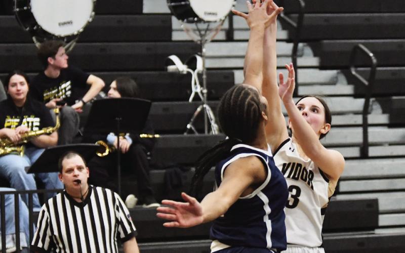 Allie Williams shoots over a West Orange Stark defender Tuesday night in Pirate gym.