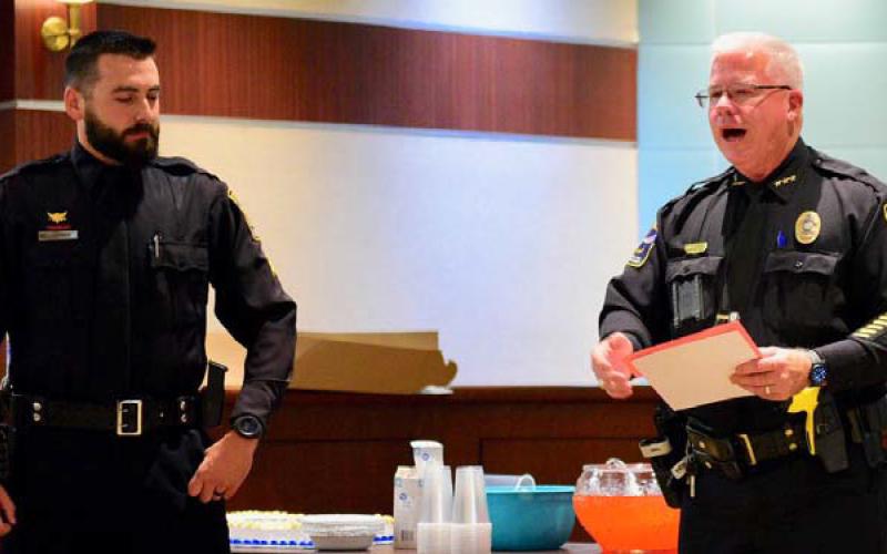 VPD officer Ethan Mansfield, left, was promoted to the rank of sergeant by VPD Chief Rod Carroll, left, in a cermony held at Vidor City Hall Monday. Courtesy Photos
