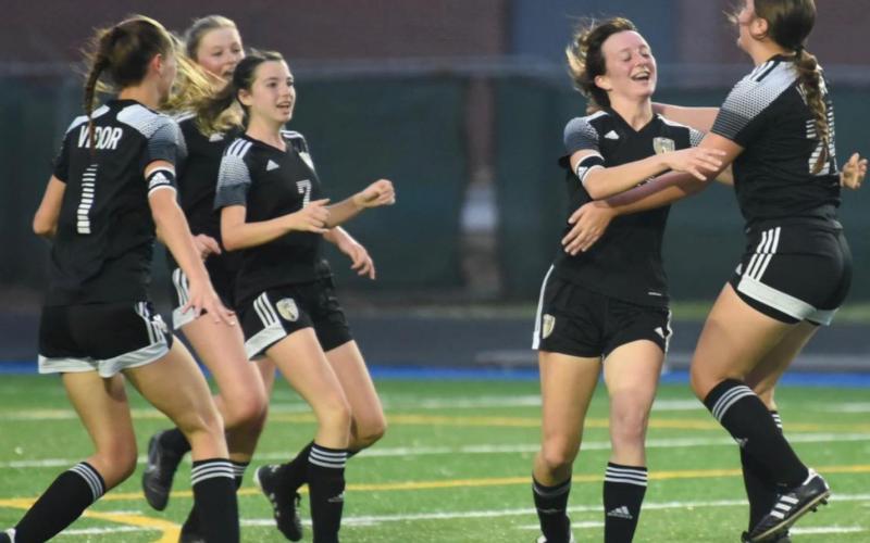 Lady Pirates are jubilant after Amelia Wright, second from right, scored a goal in the first half of the Area Playoff game Tuesday. Photo by Randall Luker