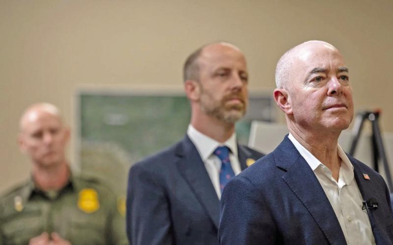 U.S. Secretary of Homeland Security Alejandro Mayorkas, right, listens as President Joe Biden receives a briefing from U.S. Customs and Border Protection, USCIS and ICE during a visit to Brownsville on Thursday, Feb. 29, 2024. Credit: Eli Hartman/ The Texas Tribune