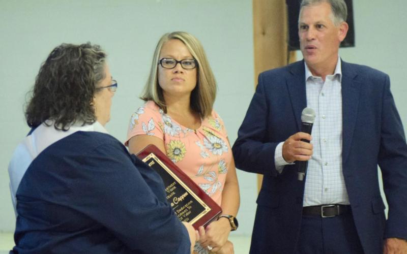 Captain Aleta Cappen is presented an appreciation plaque for her years of service to the city of Vidor by Mayor Misty Songe, center, and Vidor City Manager Robbie Hood, right, at her retirement celebration at The Oaks. Orange County and Texas Speaker of the House Date Phelan were also among those presenting Cappen with tokens of appreciation for her dedication and service to the community. Photo by Randall Luker