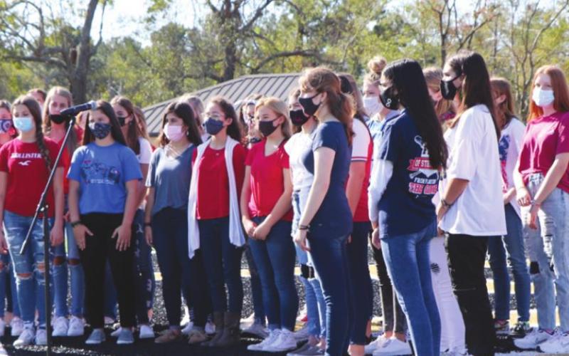 The Vidor Junior High choir performed two pieces, including the service medley, in which all veterans were asked to stand when their branch of service's song was sung.