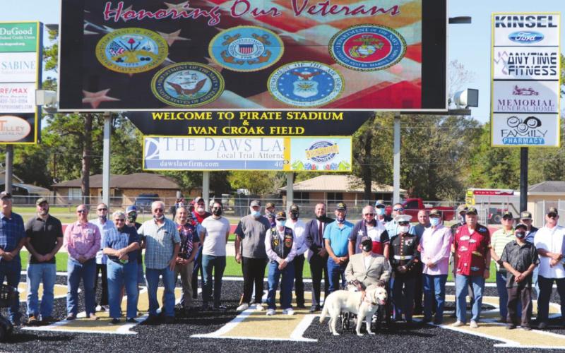 The veterans got together for a group photo after the program.