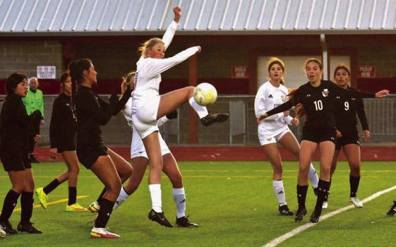 Jordan Reynolds jumps to stop and settle the ball during Friday’s final regular season game at Jasper. Photo by Randall Luker
