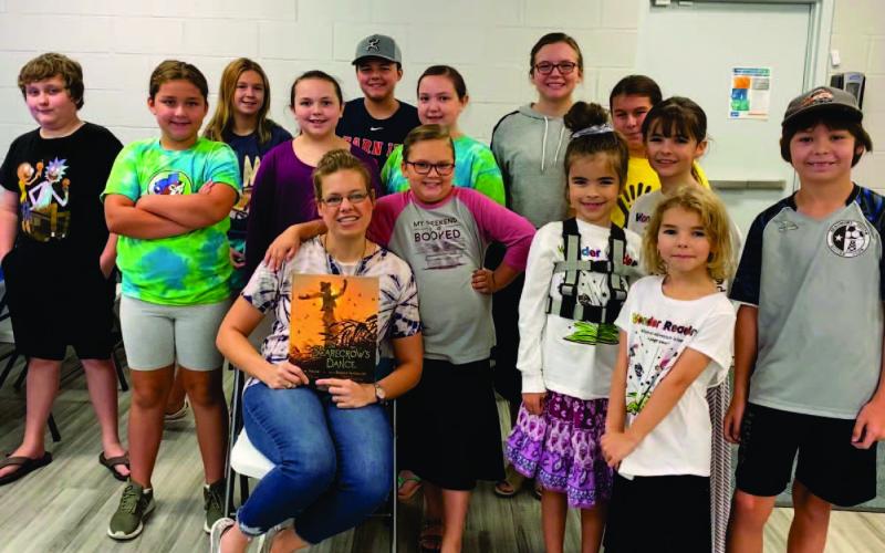 The Vidor Public Library held “Wonder Readers Story Time” on Thursday, October 6, 2022. Library clerk Sarah Screws read “The Scarecrow’s Dance” by Jane Yolen to the audience. The story is about a scarecrow who decides to leave his station in the corn field and dance away the fall night, returning to the field after his adventure. The children painted fall canvases for the craft. Courtesy Photo