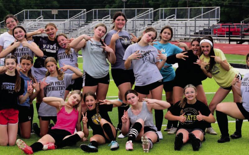 Vidor’s 8th grade Lady Pirate soccer team mugs for the camera after practice this week. This marks the first year for the 7th and 8th grade junior high girls soccer program at VISD. After a rainout last week, both teams will play their first game Thursday versus Central at Pirate Stadium with the 7th grade team at 5:30 and 8th grade at 6:50 p.m. Photo by Randall Luker