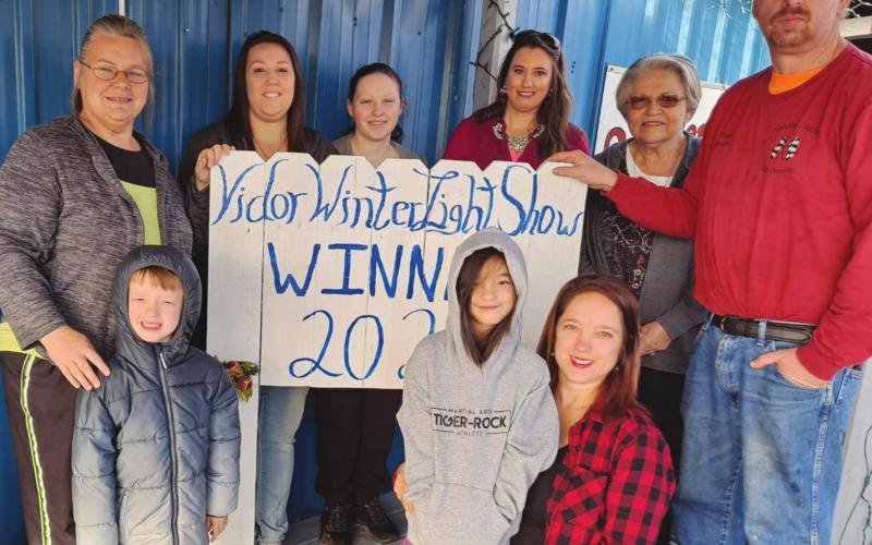 Finishing Touches Auto/Anderson Studio was selected as the winner of the 2020 Main Street Business Decorating Contest sponsored by the Vidor Winter Light Show. Pictured are Top row l to r Beverly Starkweather co-owner, Kristen Warren, Christine Grobel, Renee Lloyd, May Wilson, Paul Starkweather co-owner. Bottom row usual order Nathan Hawkins, Risa Hawkins, Kristy Hawkins, Risa Hawkins, Kristy Hawkins.