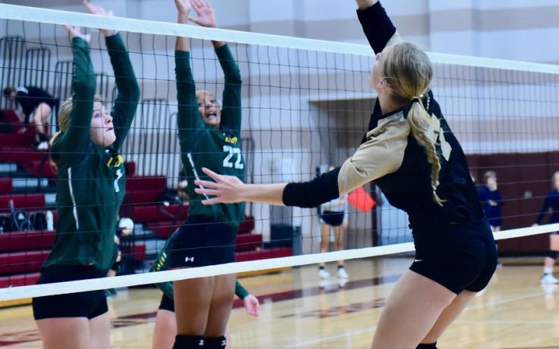 Junior varsity Lady Pirate Jaelyn Justice returns the ball in Saturday’s game versus LCM.