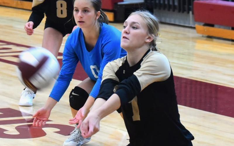Junior varsity Lady Pirate Jaelyn Justice returns the ball in Saturday’s game versus LCM.