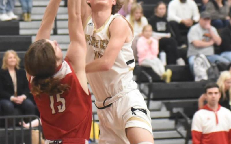 Zander Lindsey shoots during Tuesday’s game versus Bridge City. Photo by Randall Luker