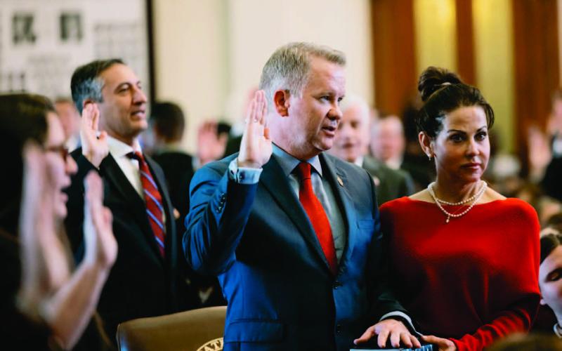 State Rep. David Cook, R-Mansfield, takes the oath of office with his hand on a bible on the first day of the 88th legislature on Jan 10, 2023. Credit: Jordan Vonderhaar for The Texas Tribune