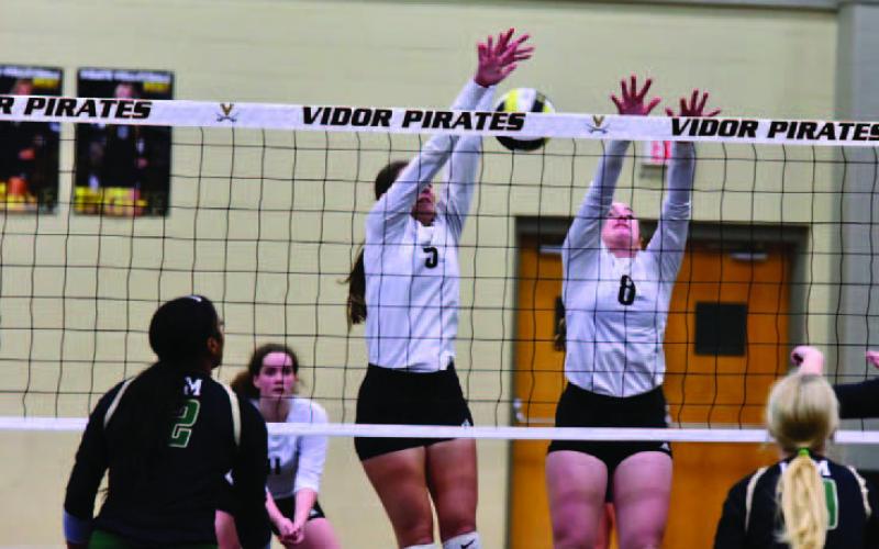 Lady Pirates Rylee Sherman, rear left, Madison Powell and Natalie Morrison defend agains the LCM Lady Bears. Photo by Randall Luker