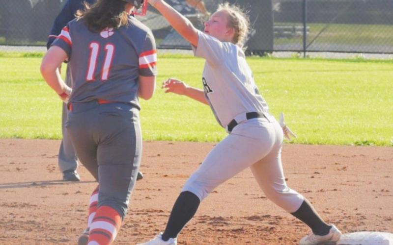 Victoria Marks reaches to make the play at first in the Lady Pirate junior varsity game Thursday.