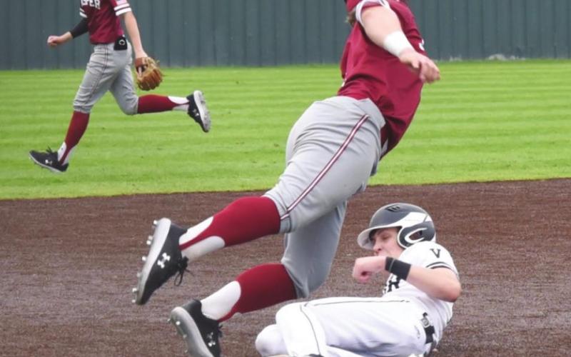 Easton Walker slides to safety as he steals third base versus Jasper Saturday in the Bridge City tournament.