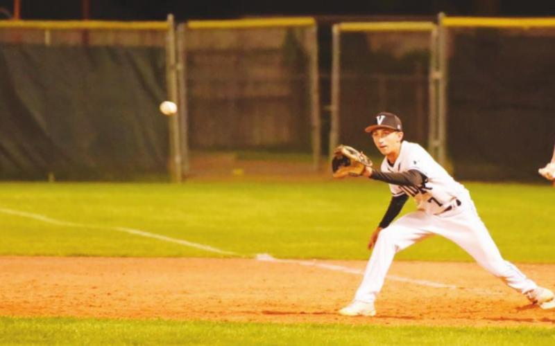 Pirate first baseman Easton Walker keeps his foot on the bag as he awaits the throw for a Bobcat out.