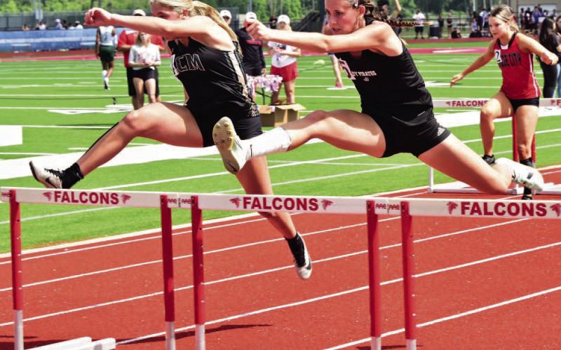 Lady Pirate Jaden Lee qualified for Regionals in four events. Lee is shown here in the 100m hurdles just ahead of LCM’s Paisley Angelle. Photo by Randall Luker