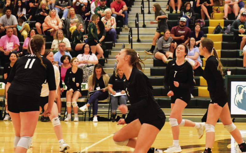 Rylee Sherman, Jaden Lee, Brilie Cornelison and Madi Powell celebrate a point versus the LCM Lady Bears last Tuesday.