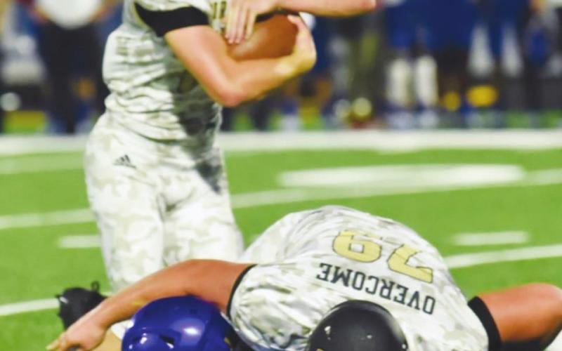 Pirate RB Jason Watson protects the ball as Tyler Webb takes a Blackcat defender to the ground in action Friday at Bay City. Photo by Randall Luker