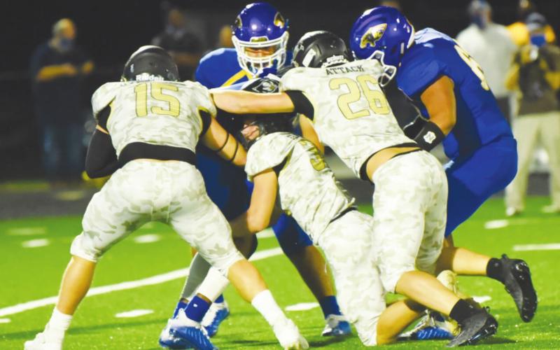 A host of Pirate defenders swarm the Blackcat ball carrier. Photo by Randall Luker