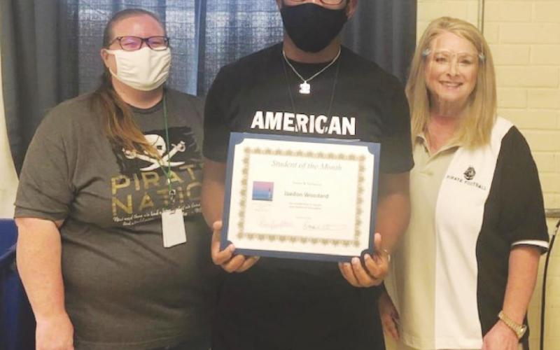 Ag Teacher Brandy Whisenant, Jaedon Woodard, Director of CTE Penny Singleton.