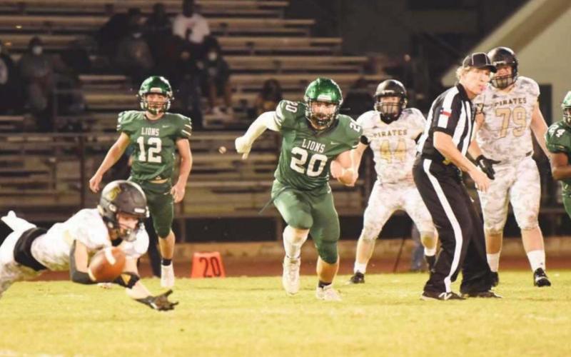 Dylan Dial stretches but can’t quite reach this pass in Friday night action versus Livingston.