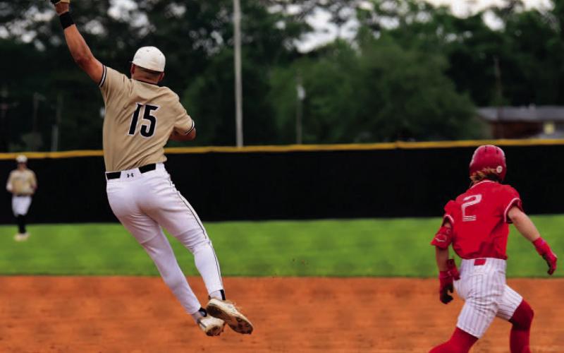 Pirate first baseman Jarrett Odom jumps to pull in an overthrown ball in Monday’s loss to Bridge City. Photo by Randall Luker
