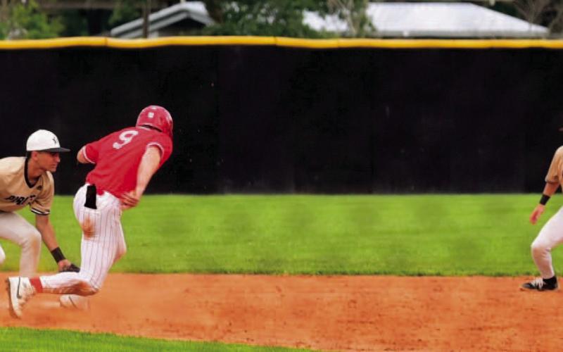 Shortstop Austin Cadroy picks off a Bridge City runner attempting to steal second base after an on the money throw fro catcher Josh Mc Cord. Second baseman Daigan Venable is providing backup on the play. Photo by Randall Luker