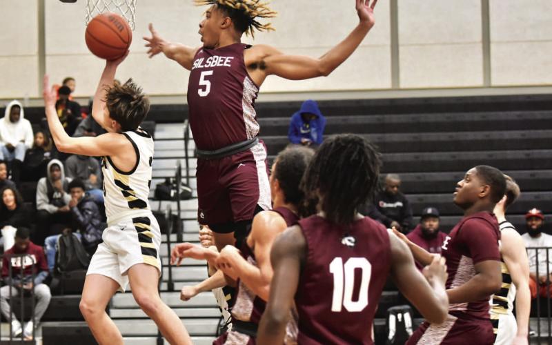 Jose Guerrero-Evans attempts a layup in Friday’s varsity game versus Silsbee. Photo by Randall Luker
