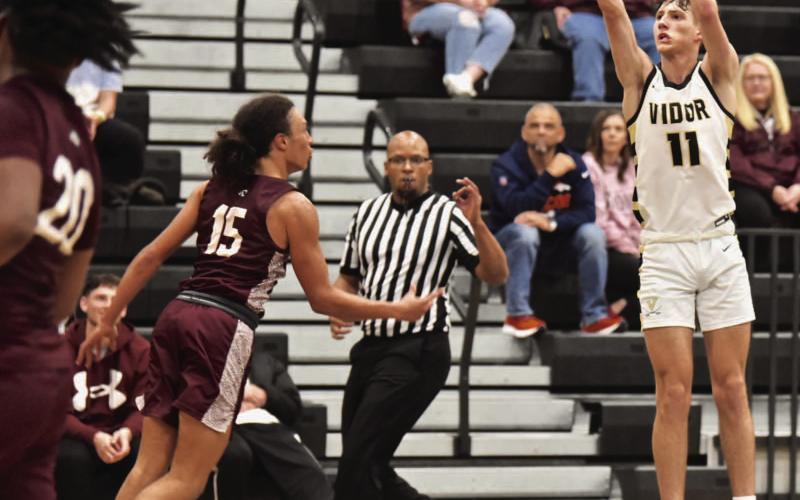 Zander Lindsey takes a long distance shot over a Silsbee Tiger Friday. Photo by Randall Luker
