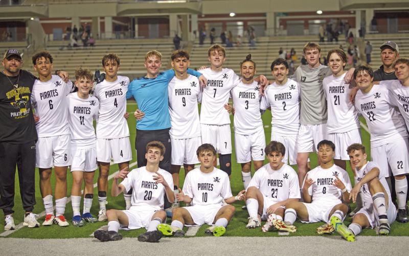 Pirates celebrate their bi-district win Monday.
