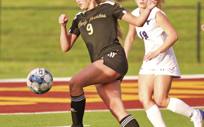 Quincy LaPray takes her shot at a goal.