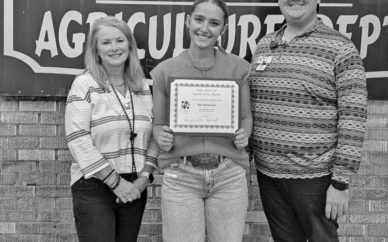 Ag teacher Mr. Tyler Root with Zoe Huntman and CTE Director Penny Singleton