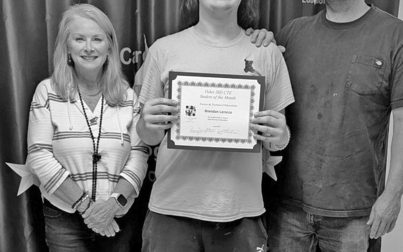 (RIGHT) BT Teacher Eric Hartman with Brendan Larocca and CTE Director Penny Singleton