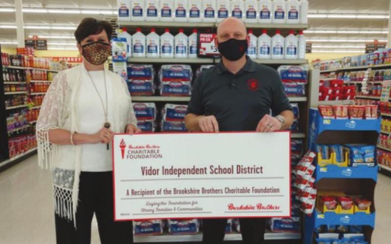 The Brookshire Brothers Charitable Foundation proudly presented a grant to the Vidor Independent School District on Wednesday, February 24, 2021. Pictured from left to right: Sally Andrews, VISD; and Robert Williamson, Brookshire Brothers store director.