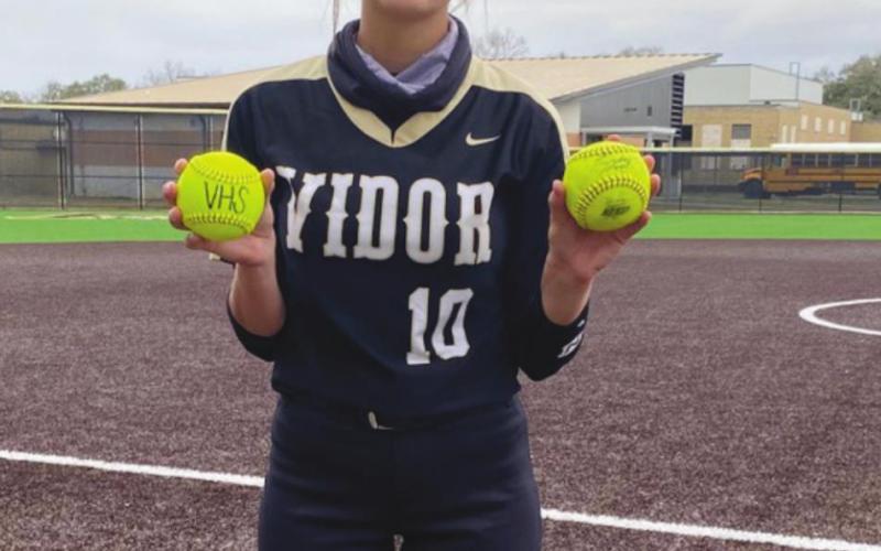 Andreya Garrett holds her two home run balls from the Hardin game.