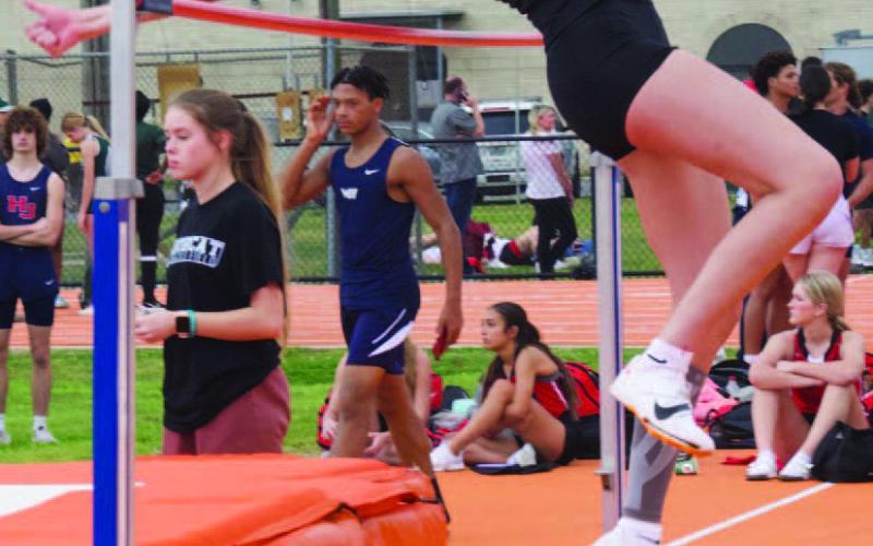 Raegan Stephenson shows great form as she clears 5’ 8” to set a new personal best at the Orangefield Relays Thursday. Photo by Randall Luker